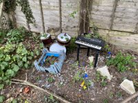 Fairy garden outside somebody's house near the woods.