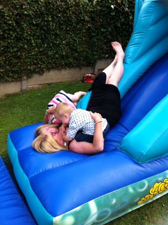 2014-08-03 22.40.53 Squidging Nanna on the bouncy castle